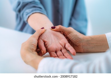 Examining The Hand Of A Senior Patient With Carpal Tunnel Syndrome. Close-up Image Of Senior Woman’s Wrist.