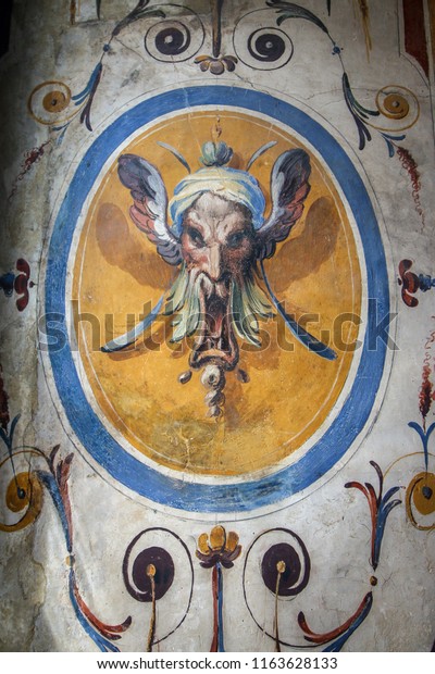 Example of a 16th\
Century Grotesque or Grottoesque painting. The Grotesque style is\
derived from paintings discovered in the basement of the Roman\
Ruins of Nero\'s Domus\
Aurea