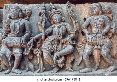 Example of ancient Indian architecture and traditional style relief, with drummer musicians and dancing Hindu goddess inside the 12th century Hoysaleshwara temple in Halebidu, India. - Powered by Shutterstock