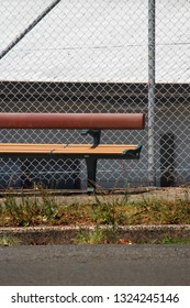 Example of hostile design or aggressive design.  The placement of the arm rest does not allow a homeless person to lay on the bench.
