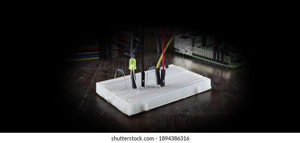 example of led connection to a pcb. collage of components related to robotics and electronics. circuit of LEDs, resistors, colored cables, connections. workshop or school to learn electronics.