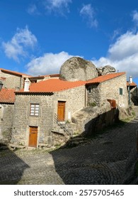 Example of an old residence built around a big boulder in Monsanto Portugal 