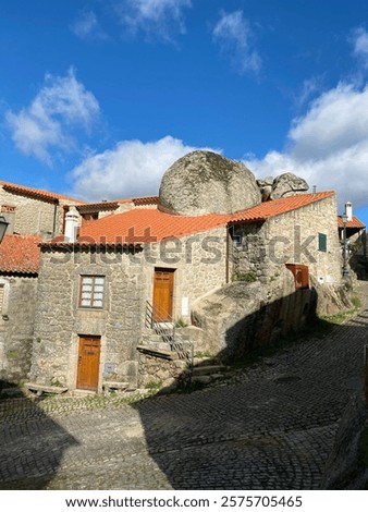 Example of an old residence built around a big boulder in Monsanto Portugal 