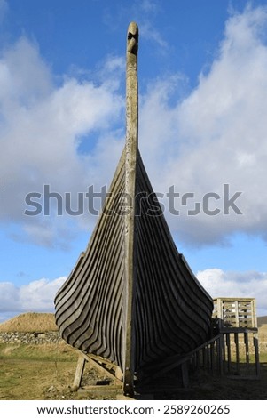 An example of an old Viking longboat on the coast of the Shetland Islands in Scotland