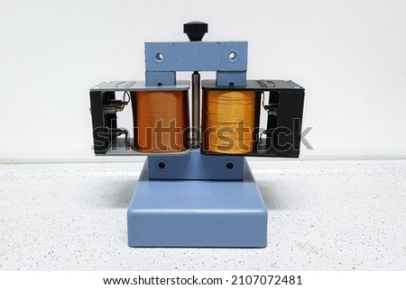 Example of a transformer. Two coils of copper wire for transforming the voltage to a higher or lower level.