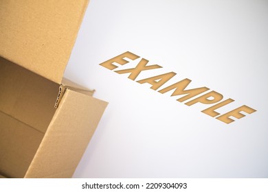 Example Word With Cardboard Box. Brown Folded Card Box.