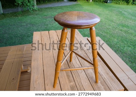 Examples of homemade stools on a deck table. Made of black cherry, ash, oak and pressure treated woods.