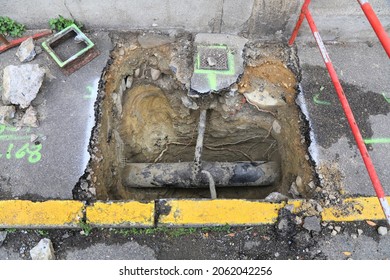 Excavating Old Underground Gas Pipeline Under Sidewalk In France. Gas Infrastructure Repair And Maintenance.