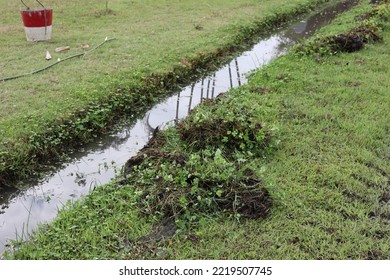 Excavation Of Soil, Drainage Channels That Are Covered With Weeds, Causing Flooding.