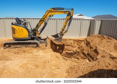 Excavation works for the installation of a swimming pool.Swimming pool under construction.Construction site.