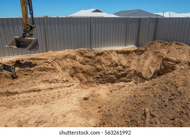 Excavation Works For The Installation Of A Swimming Pool.Swimming Pool Under Construction.