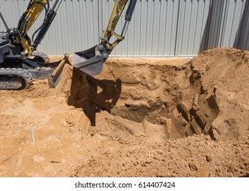 Excavation Works For The Installation Of A Swimming Pool.Swimming Pool Under Construction.