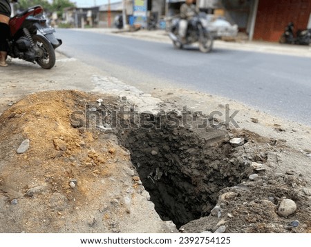 Excavations that are not immediately closed can endanger vehicles and road users. Location : Tanjung Selamat- Deli Serdang-Indonesia.