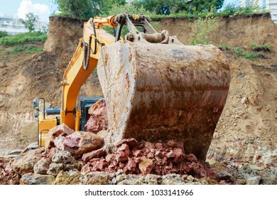 Excavator bucket close-up. Work at the construction site. - Shutterstock ID 1033141966