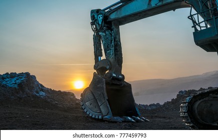 Excavator bucket, coal mine, dawn