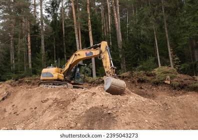 Excavator with Bucket lift up digging the soil in construction site . Heavy construction hydraulic equipment. - Powered by Shutterstock