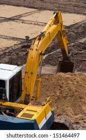 Excavator Construction Equipment Park At Worksite.