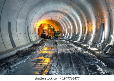 Excavator in construction place of building new railway tunnel. Railway corridor construction with machinery. - Powered by Shutterstock