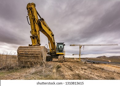 Excavator and cranes building a concrete bridge - Shutterstock ID 1310813615