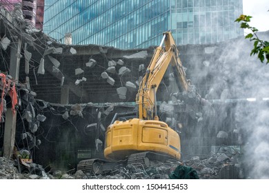 Excavator, Cutter Demolishing Old Building 