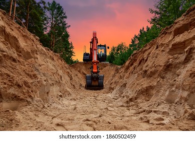 Excavator dig trench at forest area on amazing sunset background. Backgoe on earthwork for laying crude oil and natural gas pipeline or water main pipes. Construction the sewage and drainage
 - Shutterstock ID 1860502459