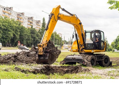 Excavator Digs A Hole