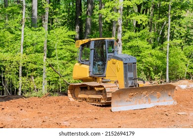 Excavator doing moving soil construction works landscaping works for construction site