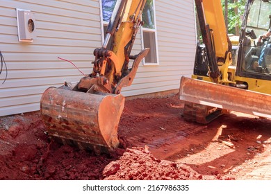 Excavator doing moving soil construction works landscaping works for construction site