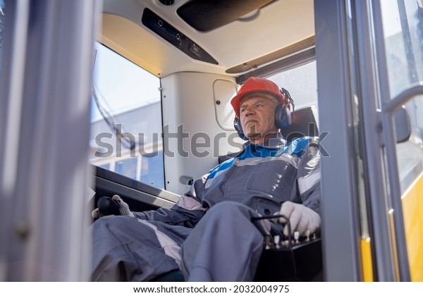 Excavator\
driver portrait, industrial senior male\
worker.