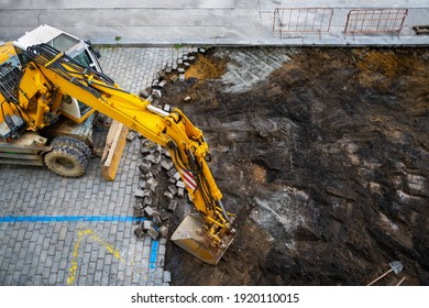 Excavator During The Cobblestone Street Reconstruction.