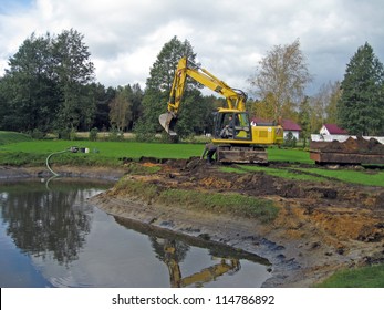 Excavator Enlarge The Small Country Farm Pond