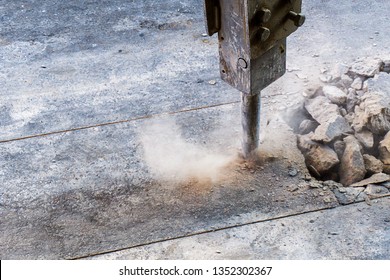 Excavator Hydraulic  Jack Hammer Is Breaking Concrete Road Prepare For Water Piping System Work