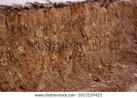 Excavator loading iron ore into the heavy dump truck on the iron ore opencast mine