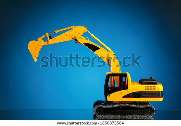 excavator model on blue\
background