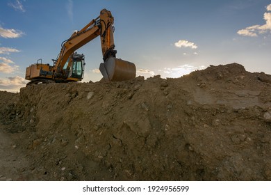 Excavator Moving Dirt And Sand At A Construction Site