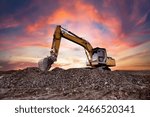 Excavator on earthworks. Excavator on construction site on sunset. Open-pit mining. Backhoe dig ground in quarry. Heavy construction equipment on excavation on construction site. Groundwork building