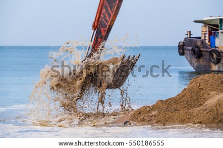Excavator on the reclamation land.