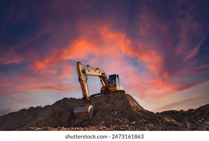 Excavator on sunset background. Open-pit mining. Backhoe dig ground in quarry. Heavy construction equipment on excavation on construction site. Excavator on groundwork on dramatic twilight. 