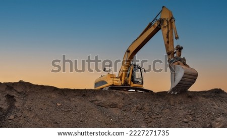 Excavator in open pit mining. Excavator on earthmoving on sunset. Loader on excavation. Earth-Moving Heavy Equipment. Earth mover ar construction site. Backhoe Loader on Road construction. 
