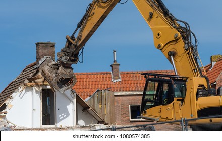 Excavator Tear Down An Old House For New Buildings