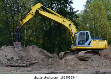 Excavator with Vertical tamrock pile foundation drilling machine. Drill rig at forest area. Ground Improvement techniques, vibroflotation probe. Vibro compaction method. Piling Contractors