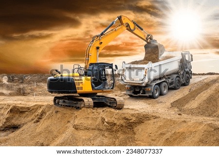  excavator is in work and digging at construction site