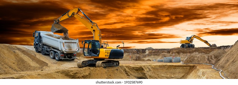 excavator at work on construction site - Shutterstock ID 1932587690