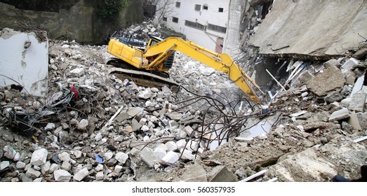 An Excavator Working At Demolition Site