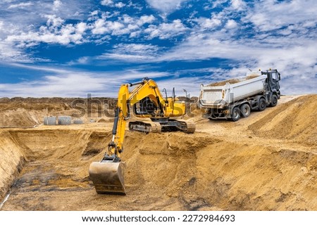  excavator is working and digging at construction site