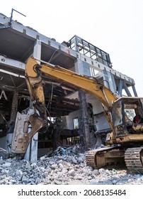 Excavator Working On Building Demolition Site.