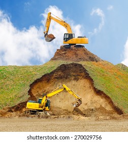 Excavators Digging Big Hole.