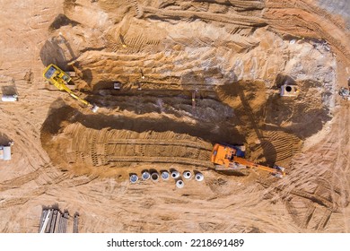 Excavators Digging Trench To Lay Sewer Pipes And Connect Underground Storm Sewer Pipes On Construction Sites