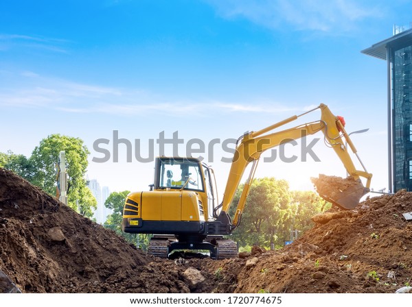 Excavators\
excavate earth at the construction\
site
