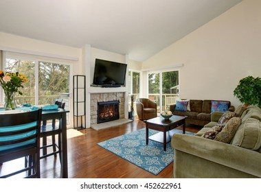 Excellent Living Room With Blue Rug, Hardwood Floor, And Fireplace.